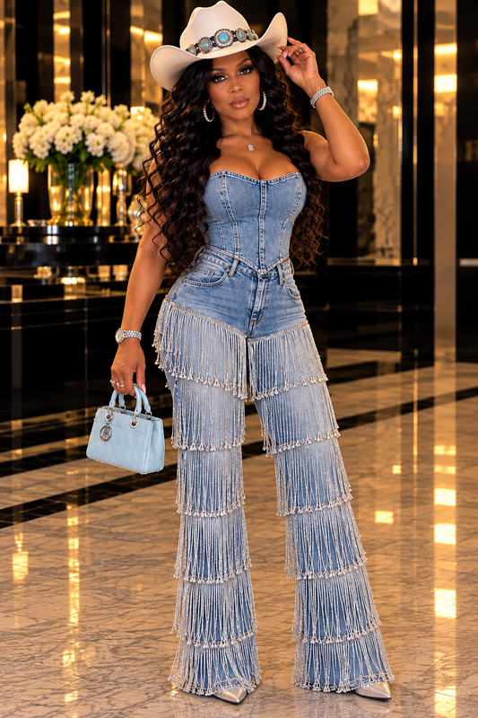 House of Della Rose owner in cowboy style silver fringe blue jeans and glam cowgirl outfit
